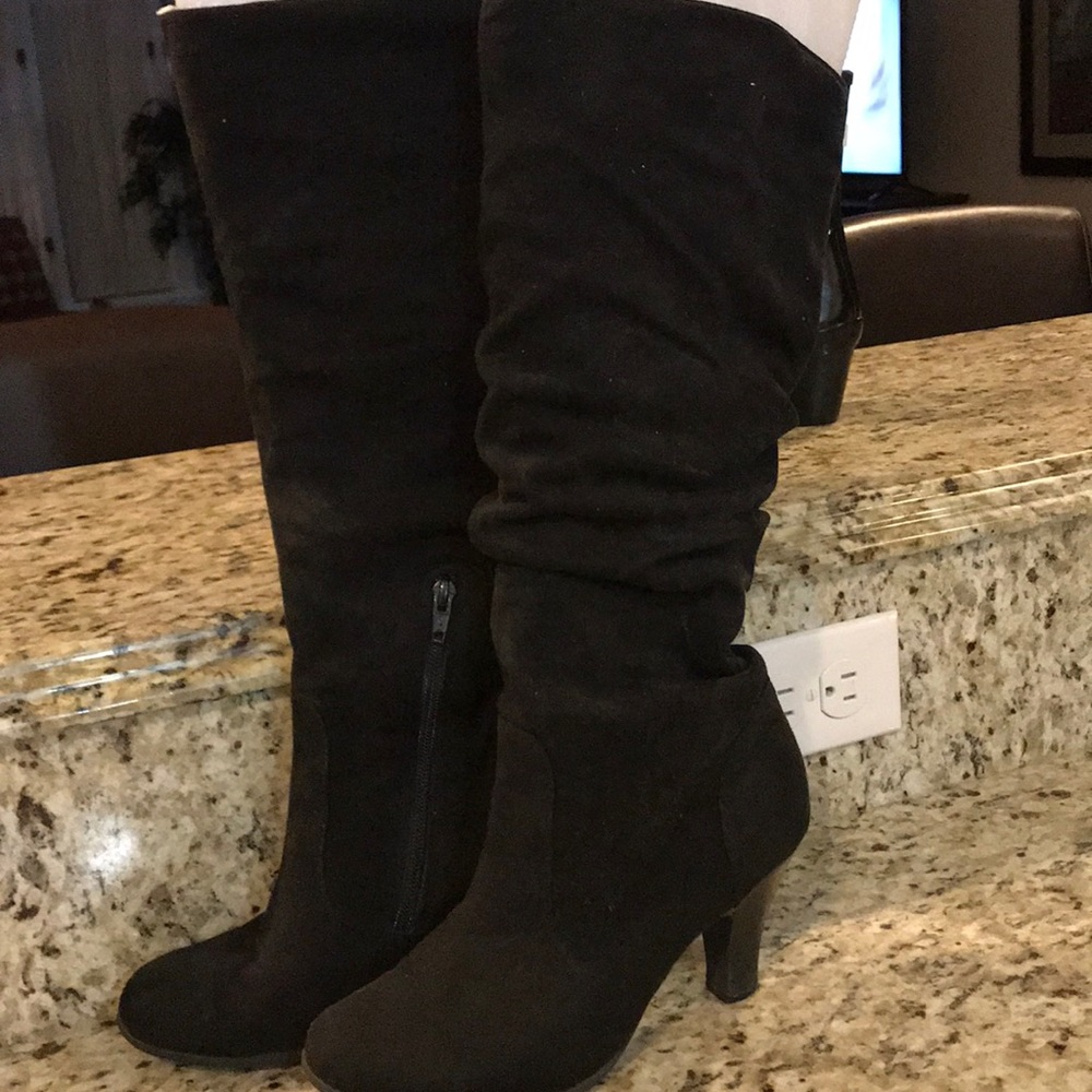 Women’s size 7M black fabric boot with 3” heel.